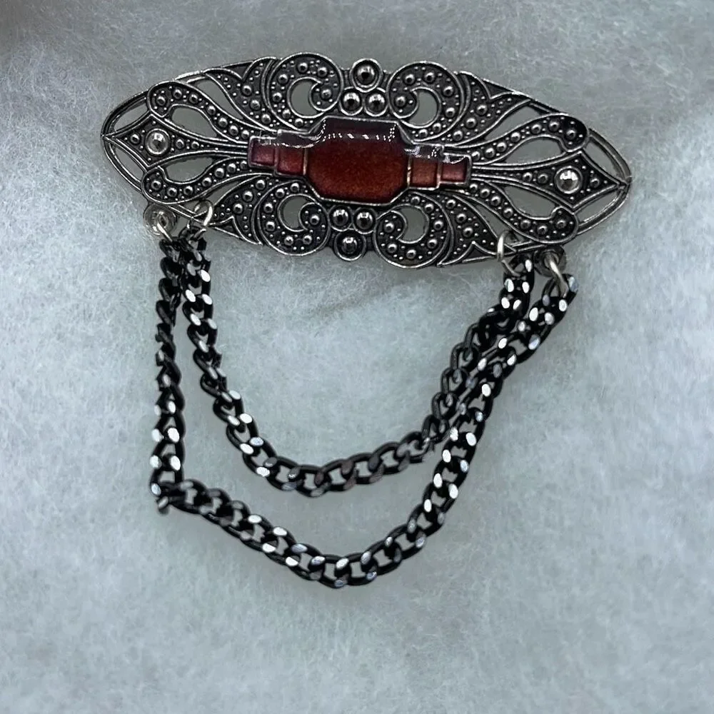 Vintage Victorian looking enamel dropping chains brooch.